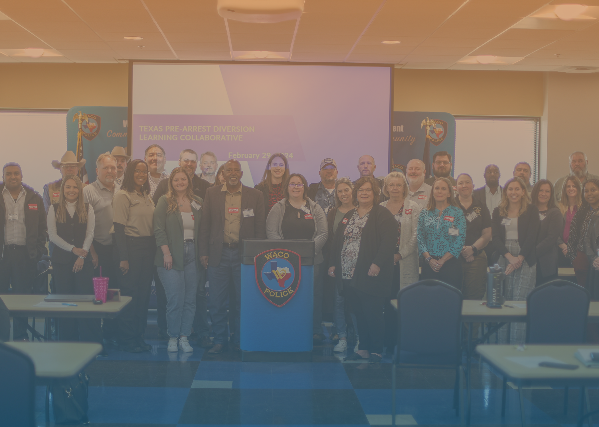 A group photo of participants at a Texas Pre-Arrest Diversion Learning Collaborative Event in Waco, TX