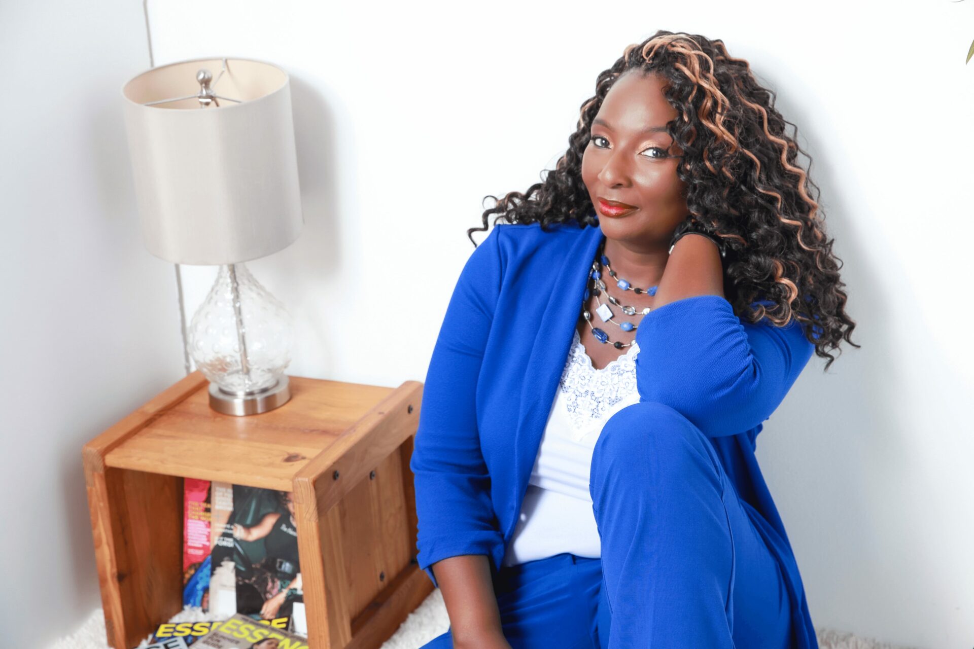 Dr. Tonicia Freeman-Foster sits next to a small table